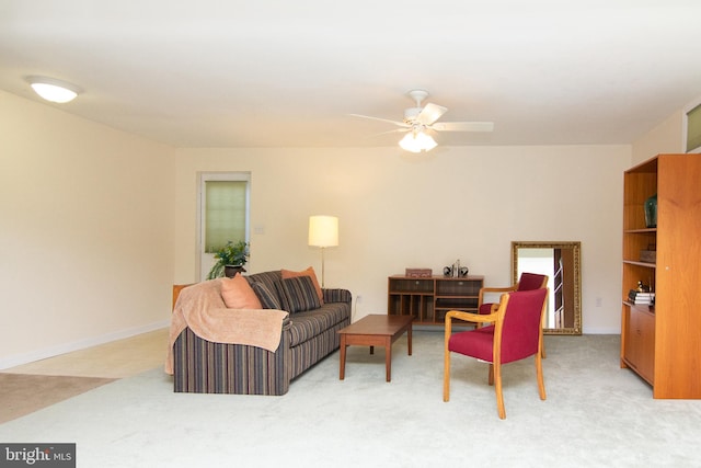 living room featuring light carpet and ceiling fan