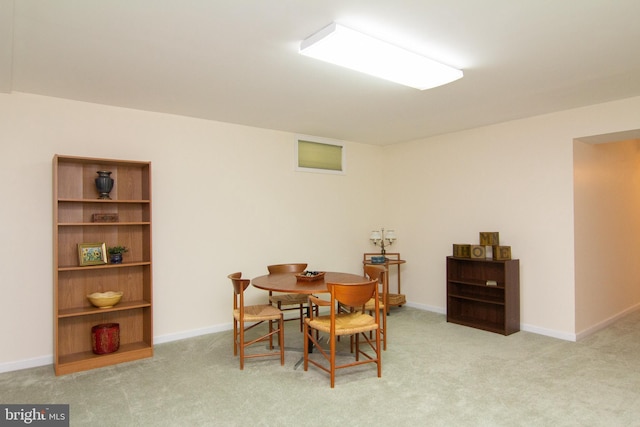 view of carpeted dining area