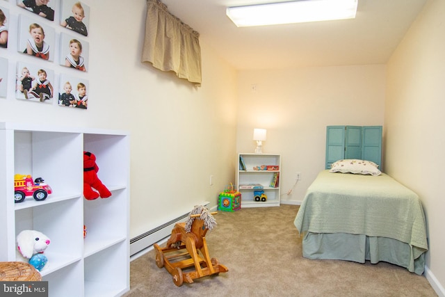 carpeted bedroom with a baseboard heating unit