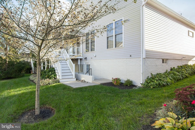 rear view of property with a yard