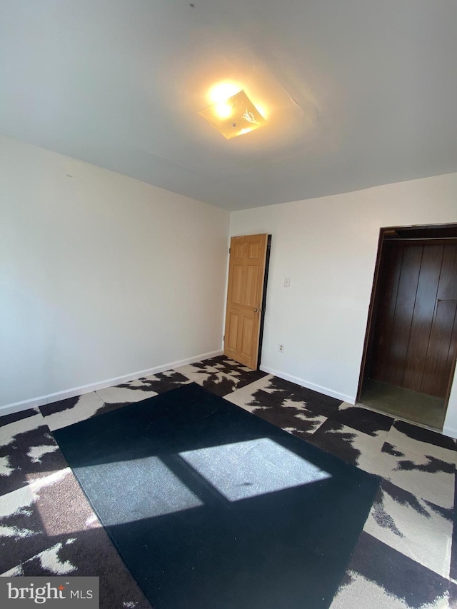 unfurnished bedroom featuring carpet floors