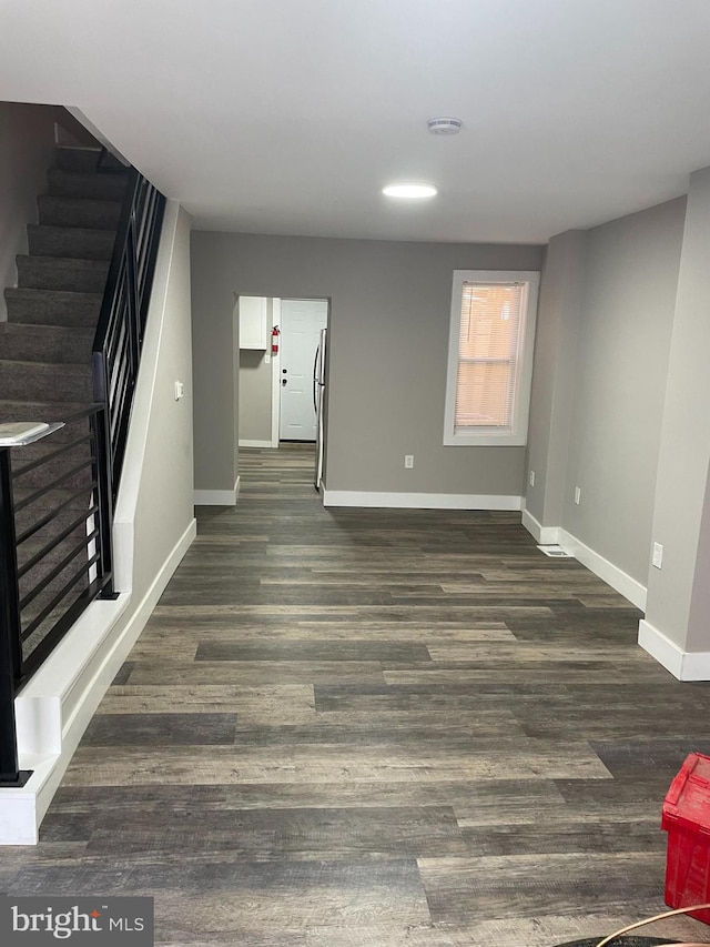 interior space with dark hardwood / wood-style flooring