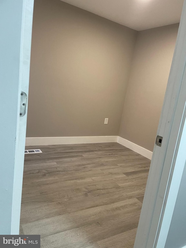 spare room featuring light wood-type flooring