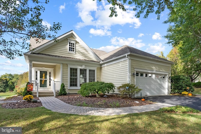 view of front facade with a front lawn and a garage