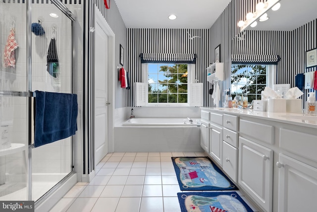 bathroom featuring vanity, tile patterned floors, and separate shower and tub