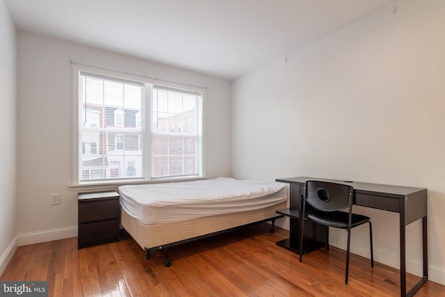 bedroom featuring light wood-type flooring