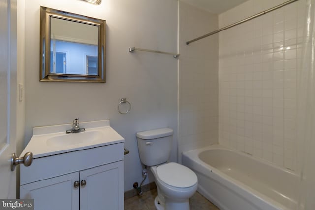 full bathroom featuring tiled shower / bath, vanity, and toilet