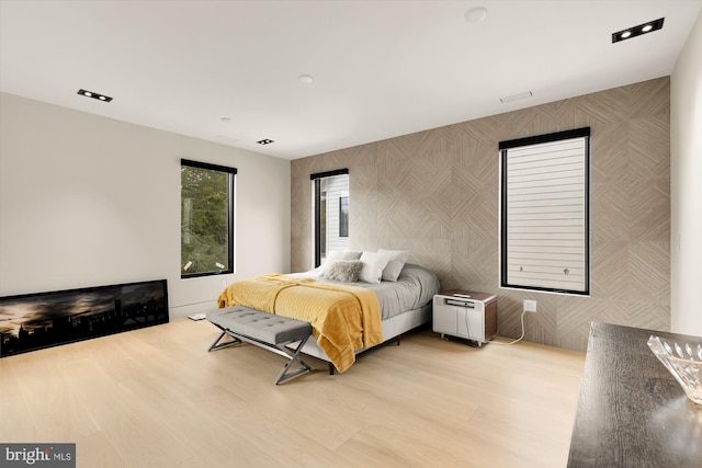 bedroom with light wood-type flooring