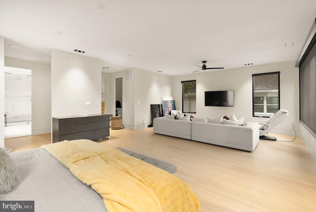 bedroom featuring ceiling fan and light hardwood / wood-style flooring