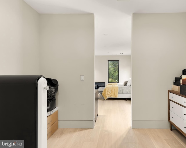 bedroom with light hardwood / wood-style flooring