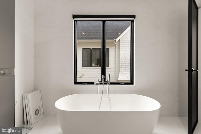 bathroom with a tub