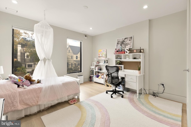 bedroom with light wood-type flooring