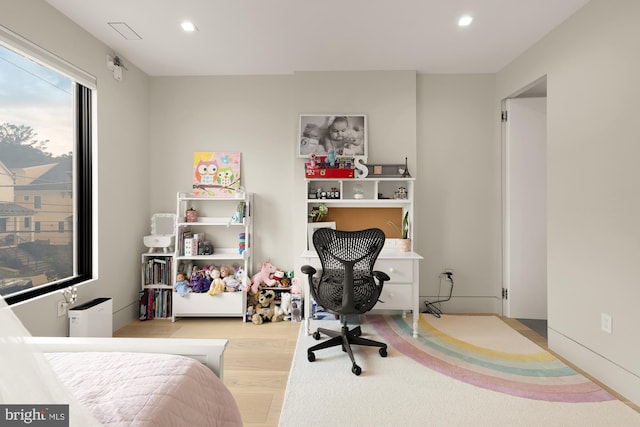 bedroom with light hardwood / wood-style flooring