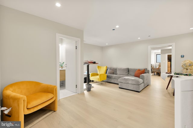 living room with light hardwood / wood-style flooring