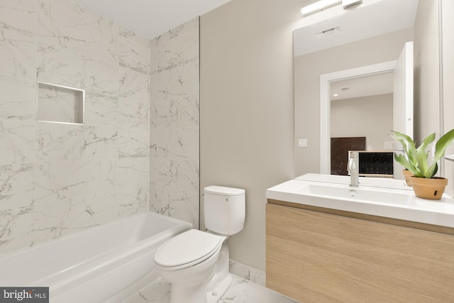 full bathroom featuring toilet, vanity, and tiled shower / bath combo