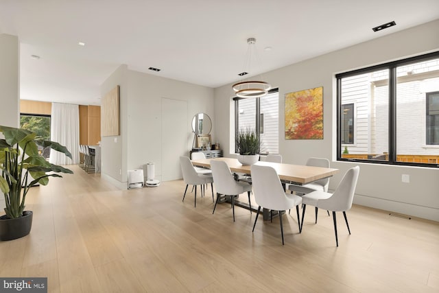 dining area with light wood-type flooring