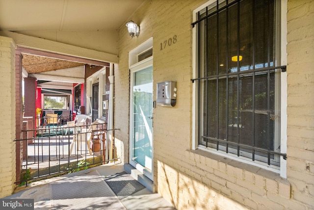 doorway to property featuring a porch