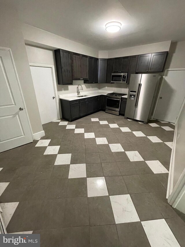 kitchen with sink and appliances with stainless steel finishes