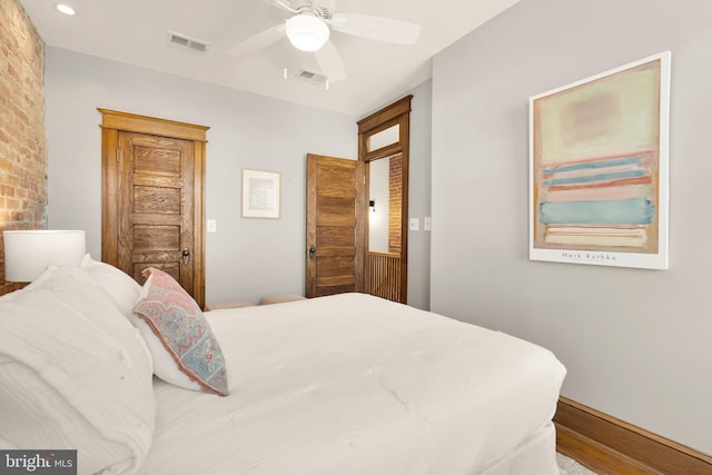 bedroom featuring hardwood / wood-style flooring and ceiling fan