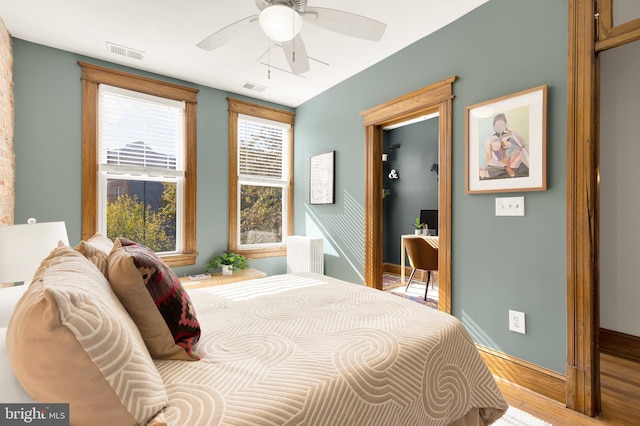 bedroom featuring ceiling fan and light wood-type flooring