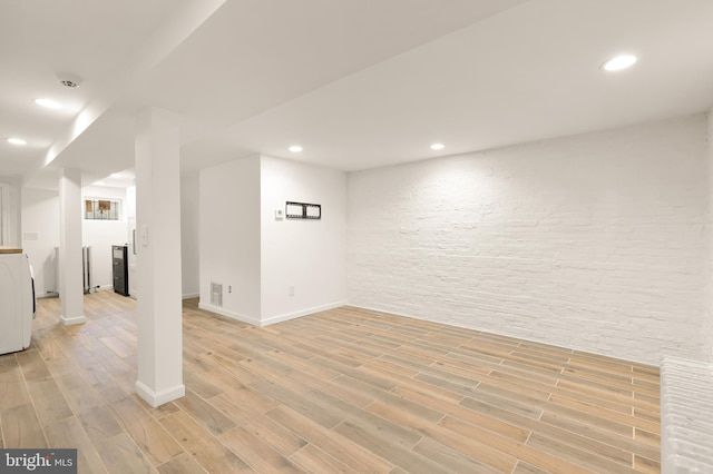 basement featuring light hardwood / wood-style flooring