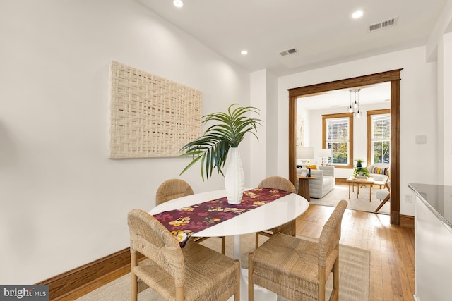 dining space featuring light hardwood / wood-style flooring