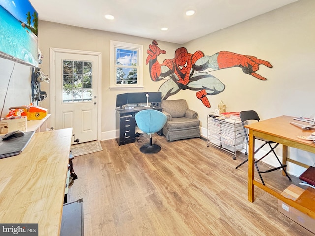 office space with light hardwood / wood-style flooring