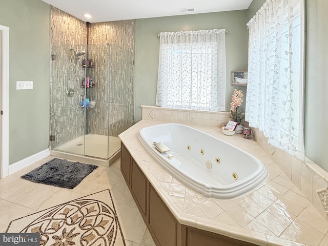 bathroom with plus walk in shower and tile patterned flooring