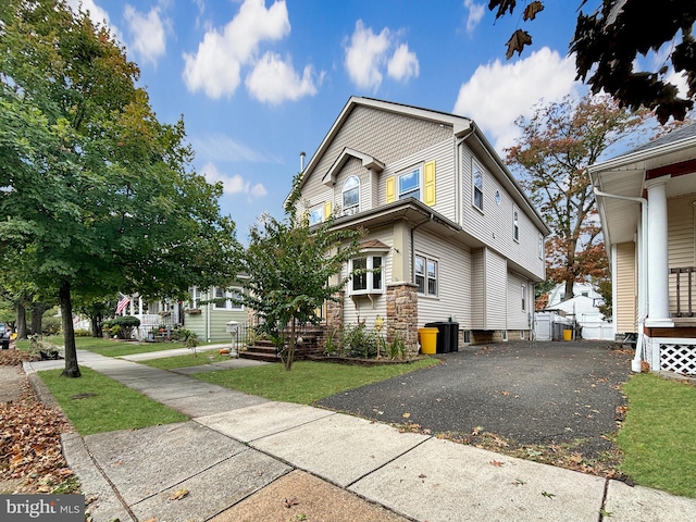 view of home's exterior featuring a lawn