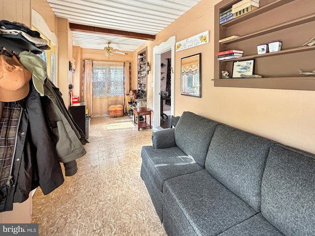 living room with beam ceiling and ceiling fan