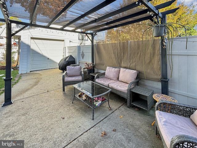 view of patio with grilling area, a garage, an outbuilding, a pergola, and outdoor lounge area