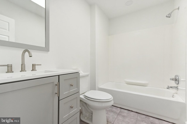 full bathroom featuring vanity, toilet, tile patterned floors, and shower / tub combination