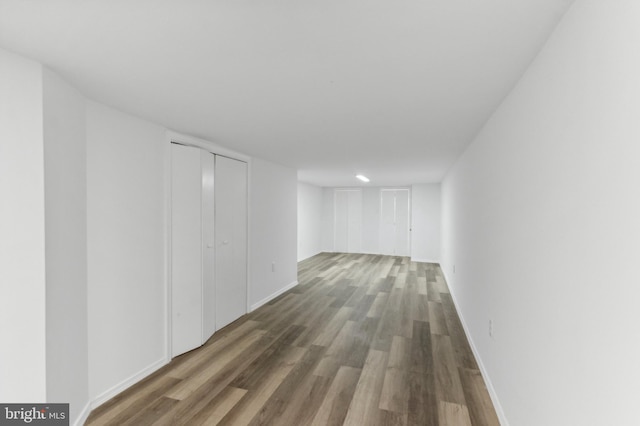 basement with hardwood / wood-style floors