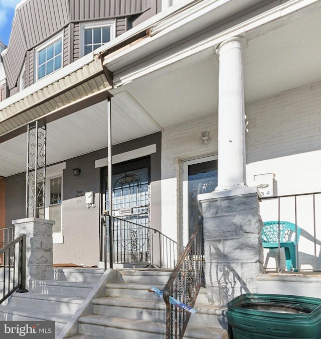 doorway to property with a porch