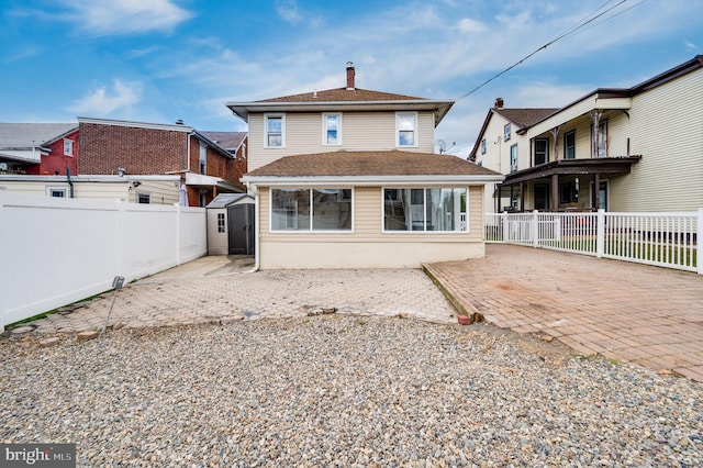 back of property with a patio