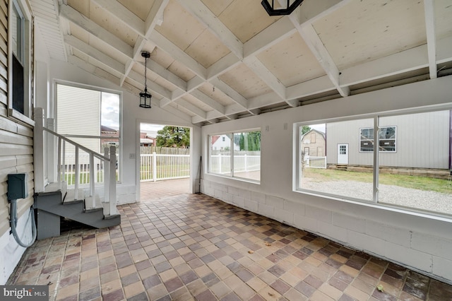 unfurnished sunroom with lofted ceiling