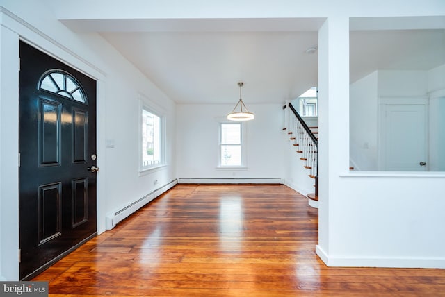 entryway with a baseboard heating unit and dark hardwood / wood-style floors