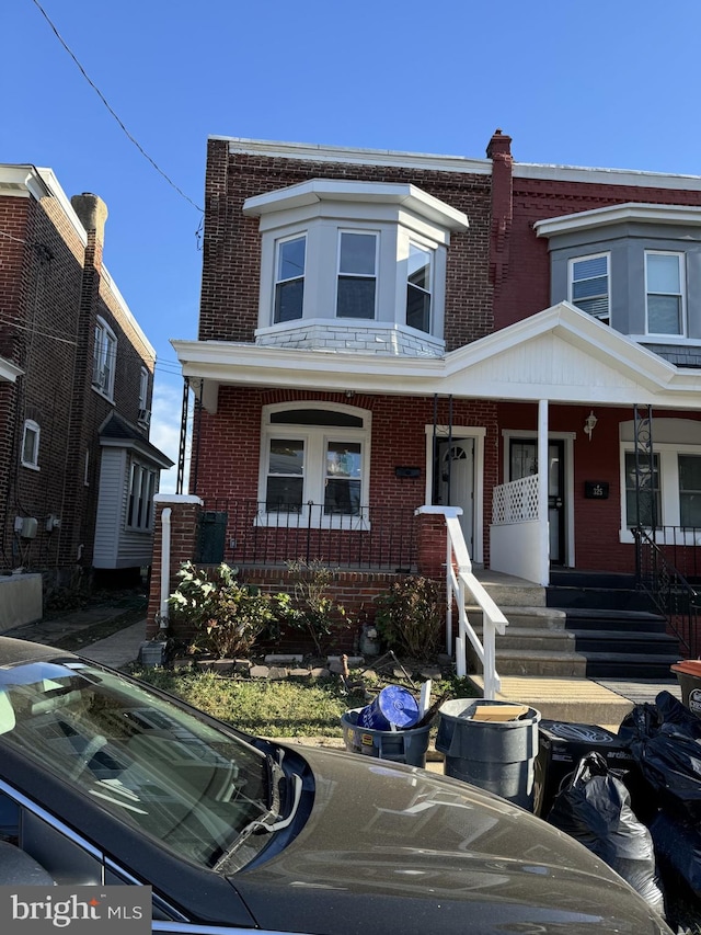 multi unit property featuring a porch