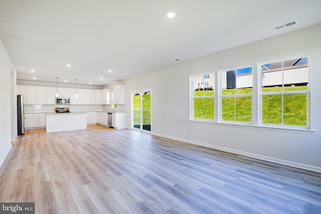 unfurnished living room featuring light wood-type flooring