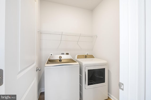 washroom featuring independent washer and dryer