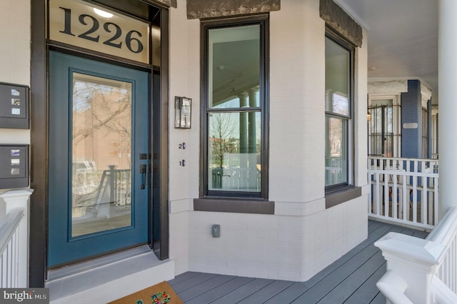 doorway to property with covered porch