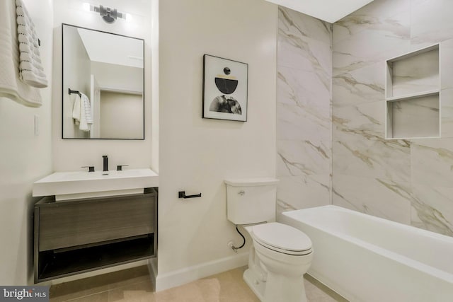 full bathroom featuring vanity, tiled shower / bath combo, and toilet