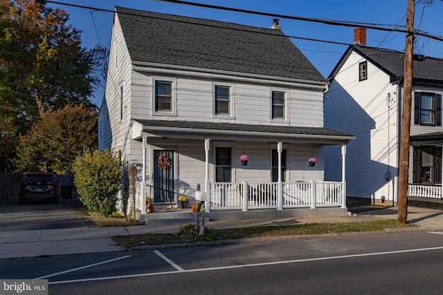 view of front of property featuring covered porch