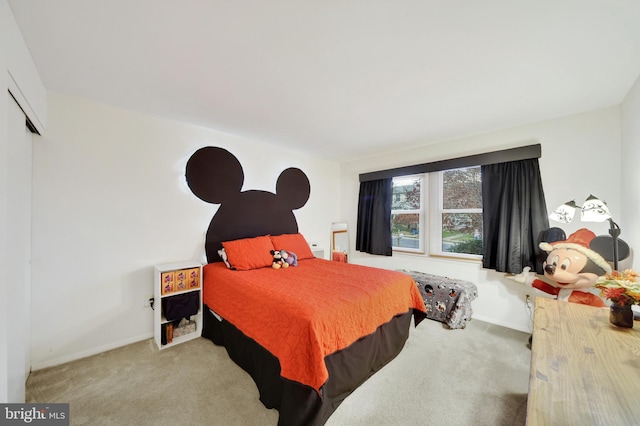 bedroom featuring light colored carpet