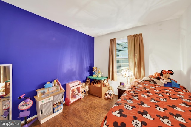 bedroom featuring wood-type flooring