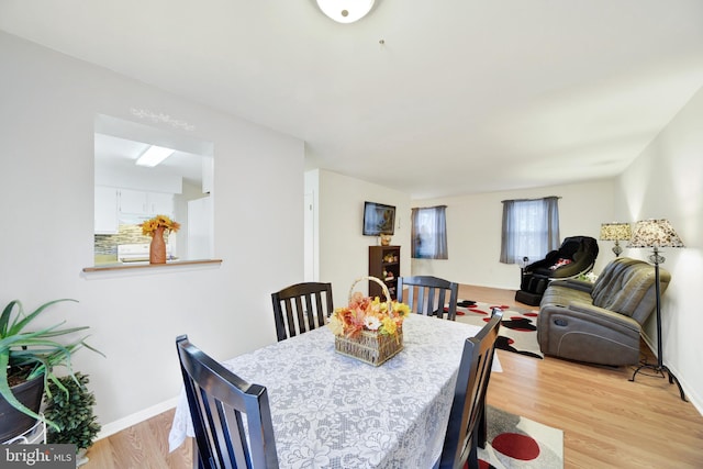 dining room with light hardwood / wood-style floors