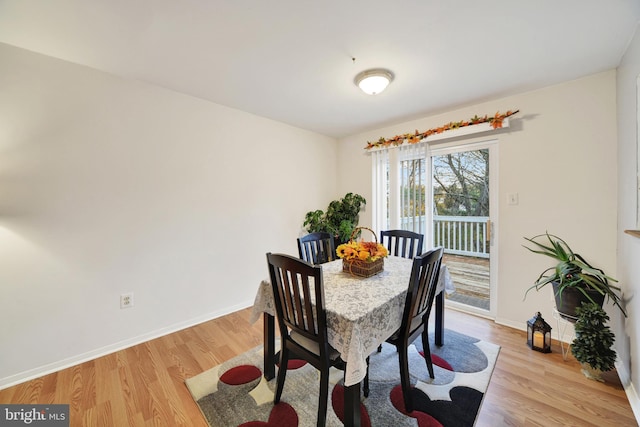 dining room with light hardwood / wood-style flooring