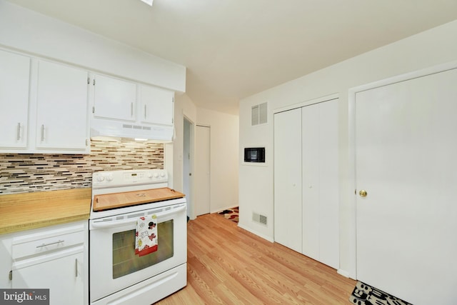 kitchen with backsplash, white range with electric cooktop, white cabinetry, and light hardwood / wood-style flooring