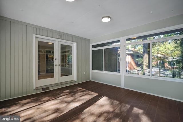 unfurnished sunroom featuring french doors