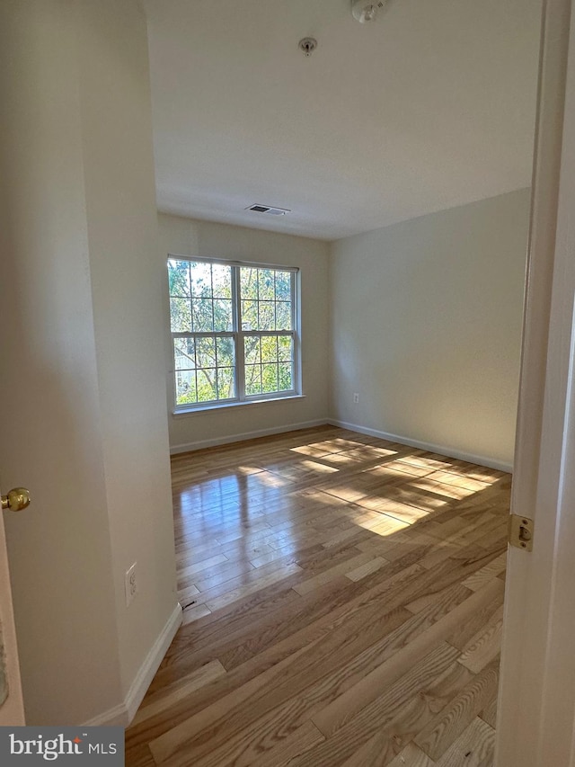 empty room with light wood-type flooring